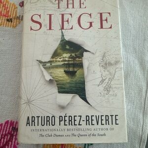The Siege Hardcover Book by Arturo Pérez‑Reverte – Historical Mystery
